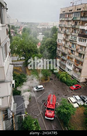 Firefighters arrived in fire trucks to the apartment building in big ...