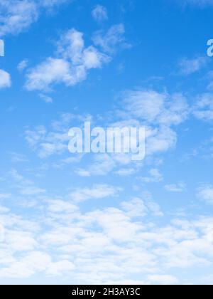 small light fluffy clouds in blue sky on sunny autumn day Stock Photo
