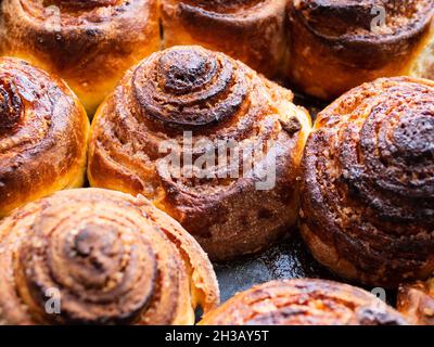 many homemade fresh baked cinnamon buns close up Stock Photo