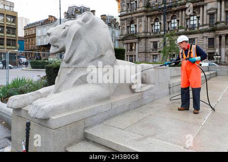 Glasgow, UK. 27th Oct, 2021. Workmen were cleaning the City's Cenotaph and symbolic Lions in George Square, outside the City Chambers, using high pressure water guns in preparation for the annual Remembrance Day commemorations in November. Credit: Findlay/Alamy Live News Stock Photo