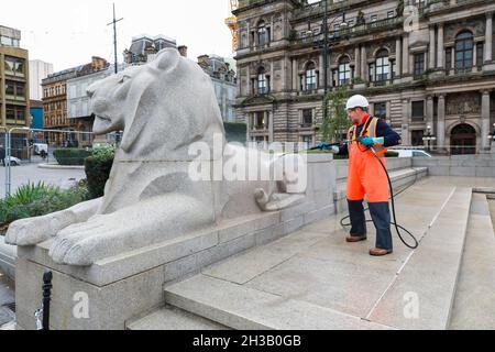 Glasgow, UK. 27th Oct, 2021. Workmen were cleaning the City's Cenotaph and symbolic Lions in George Square, outside the City Chambers, using high pressure water guns in preparation for the annual Remembrance Day commemorations in November. Credit: Findlay/Alamy Live News Stock Photo