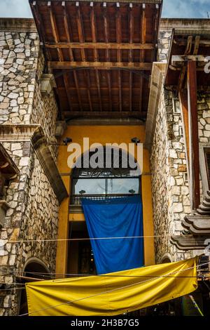 Top of a colourful old colonial building of stone construction and wooden rooftop at the Central Market, Port-Louis, Mauritius Stock Photo