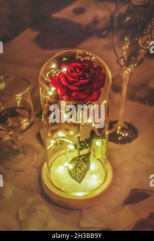 PARIS, FRANCE - Oct 20, 2018: Rose under a glass with lights Stock Photo