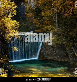 A view of the Pisnica Waterfall near Kranjska Gora in the Julian Alps of Slovenia in late autumn Stock Photo