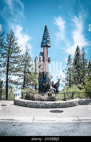 06-01-2021 Lake Tahloe USA Statue of tree and eagle and bear and deer at park on shores of Lake Tahoe Stock Photo