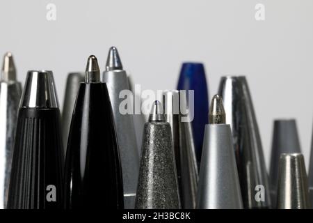 Some miscellaneous used ball pens in a pile . Office accessories. Stock Photo