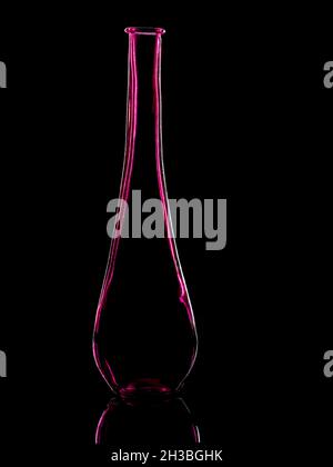 Outline of a magenta glass vase on black background Stock Photo