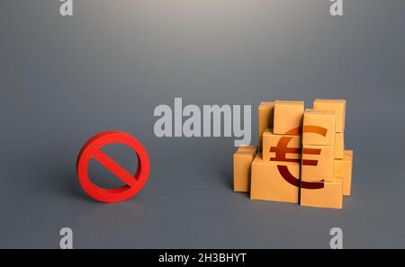 Euro goods boxes and prohibition symbol NO. Trade wars. A ban on import of goods. Impossibility of transportation, oversupply. Shortage of goods. Sanc Stock Photo