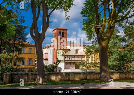 Travelling in Tuscany. The Walls of Lucca public park with San Ponziano (St Pontianus) Church Stock Photo