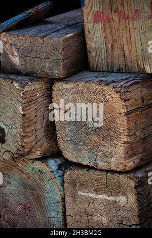 Pile of 6x6  wood posts stacked on pier. Stock Photo