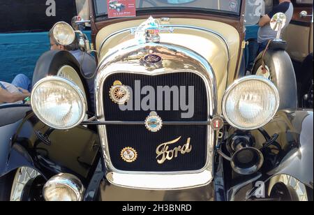 AVELLANEDA - ARGENTINA, ARGENTINA - Sep 27, 2021: Front view of an old yellow Ford Model A Phaeton 1929. Grill. Expo Fierros 2021 classic car show Stock Photo