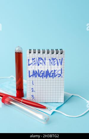 Text sign showing Learn New Languages. Business concept developing ability to communicate in foreign lang Writing Important Medical Notes Laboratory Stock Photo