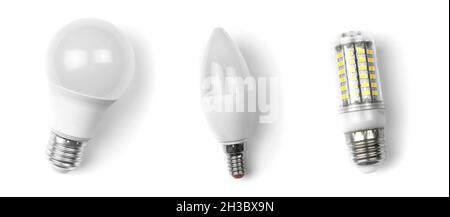 Different light bulbs, white background. Energy saving concept. Banner design, flat lay, top view Stock Photo