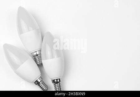 Energy saving and eco friendly LED light bulbs. White silver background, flat lay, top view and copy space Stock Photo