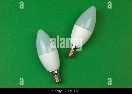 Energy saving and eco friendly LED light bulbs. Green background, flat lay, top view and copy space Stock Photo