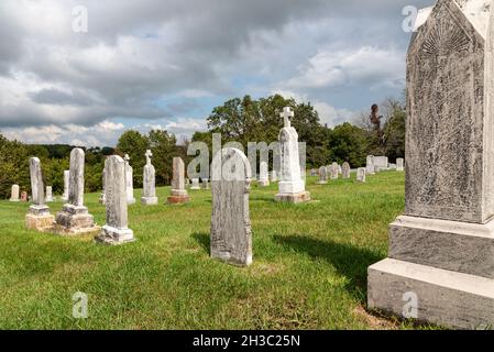 Headstones marking the gravesites of people who are buried in the Midwest USA in the late 1800s and early 1900s. Stock Photo