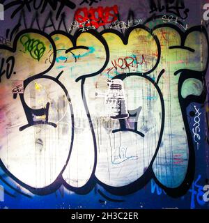 SYDNEY, AUSTRALIA - Sep 16, 2021: A Dr Who Dalek Sticker and Graffiti Tag on Wall in Newtown Suburb Laneway, Sydney, Australia