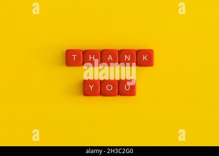 The words 'Thank you' on a red cubes Stock Photo
