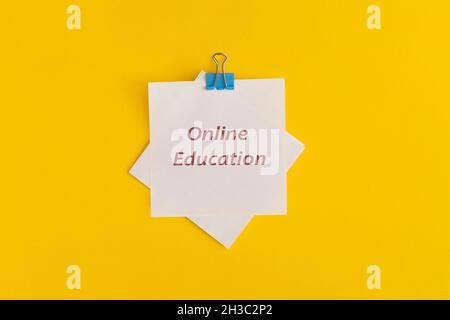 Sticky notes with the text Online Education on yellow background. Stock Photo