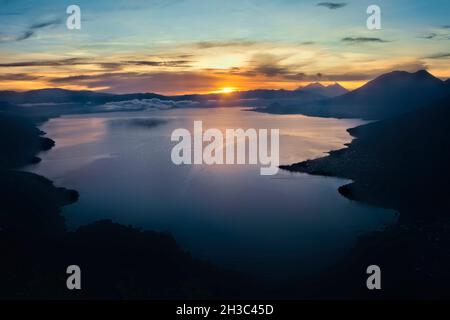 Sunrise over Lake Atitlan with Fuego, Acatenango, Toliman, and Atitlan volcanoes, Lago Atitlan, Guatemala Stock Photo