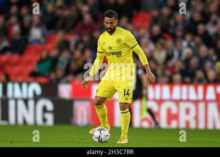 Stoke On Trent, UK. 27th Oct, 2021. Saman Ghoddos #14 of Brentford with the ball in Stoke-on-Trent, United Kingdom on 10/27/2021. (Photo by Simon Whitehead/News Images/Sipa USA) Credit: Sipa USA/Alamy Live News Stock Photo