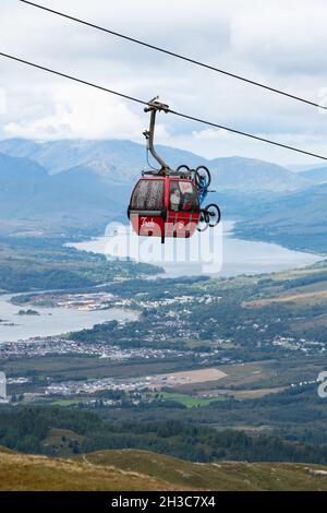 Trek branded cable car carrying people riders and mountain bikes -  Nevis Range Mountain Gondola, Fort William, Scotland, UK Stock Photo