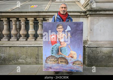 Westminster, London, UK. 27th Oct, 2021. Artist Kaya Mar with a new satirical painting depicting Chancellor Rishi Sunak with the famous red box. Credit: Imageplotter/Alamy Live News Stock Photo