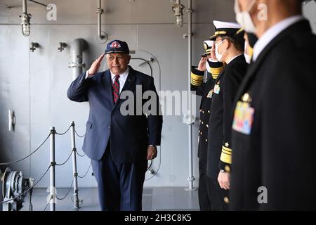 Yokosuka, Japan. 26th Oct, 2021. U.S. Secretary of the Navy Carlos Del Toro salutes officers as he departs the Japanese Izumo class aircraft carrier JS Izumo at homeport October 26, 2021 in Yokosuka, Japan. Credit: MC2 Ashley Estrella/US Navy/Alamy Live News Stock Photo