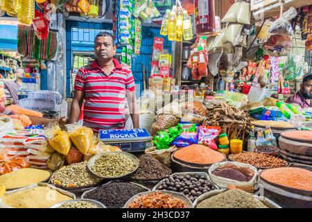 KHULNA, BANGLADESH - NOVEMBER 12, 2016: Local seller at a market in Khulna, Bangladesh Stock Photo