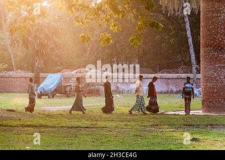 BAGERHAT, BANGLADESH - NOVEMBER 16, 2016: Evening view of local people near Sixty Dome Mosque Sha Gombuj Moshjid or Shait Gumbad mosque in Bagerhat, B Stock Photo