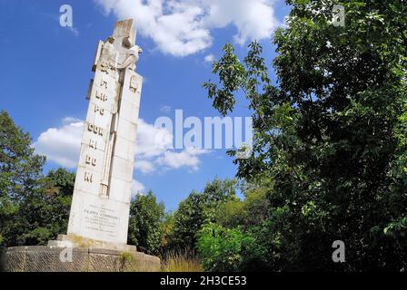 WWI, San Martino del Carso, Friuli Venezia Giulia, Italy. Near the trench called 'trincea delle frasche' one can see the memorial stone dedicated to Filippo Corridoni. He had been a union representative  before the war and died in that neighbourhood in October 23rd, 1915. The 23 meter-hig monument was made by the sculptor Francesco Ellero in 1933, to comply with the will of Benito Mussolini, who wanted to commemorated his old friend, who had died in war and his body lost without identification. A fascist sculpture, a monument shoes the symbols of that epoch : the open-hand roman hail, the east Stock Photo