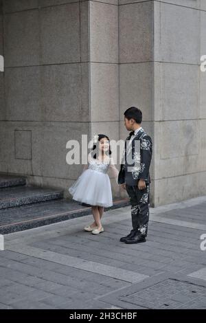 Children-brother and sister in Sunday outfit-kind of wedding dresses. Xi'an-China-1610 Stock Photo