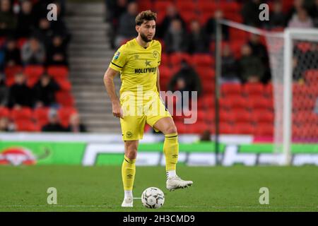 Stoke On Trent, UK. 27th Oct, 2021. Charlie Goode #4 of Brentford with the ball in Stoke-on-Trent, United Kingdom on 10/27/2021. (Photo by Simon Whitehead/News Images/Sipa USA) Credit: Sipa USA/Alamy Live News Stock Photo