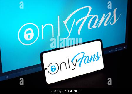 In this photo illustration an OnlyFans logo seen displayed on a
