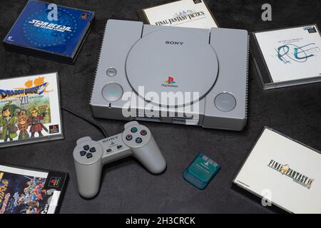 Fukuoka, Japan - october 24, 2021 : the original sony playstation 32-bit home video game console released in 1994 with some games and controller Stock Photo