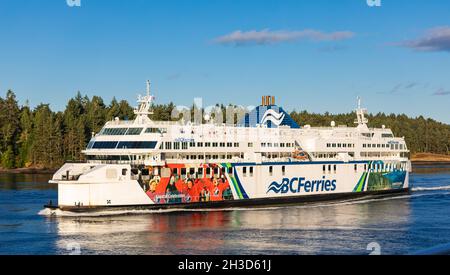 Ferry in front of Coast Mountains. BC Ferry crossing the strait in gulf islands national park. BC Ferries, Vancouver, Canada, boat, river, ferries, Stock Photo