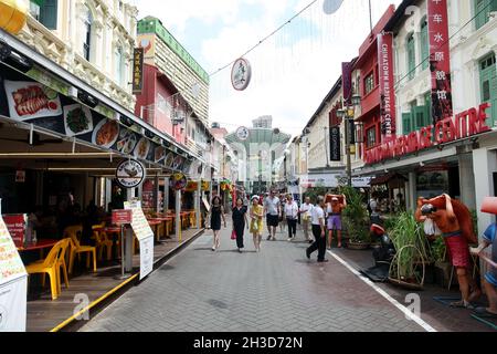 Pagoda street with the Chinatown Heritage Centre and shops and restaurants and with several people walking in Singapore's Chinatown. Stock Photo