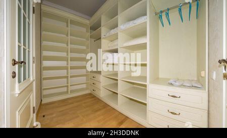 Big empty wooden dressing room, interior of a new empty modern house. Stock Photo