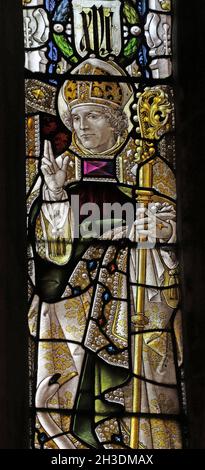 Stained glass window by Percy Bacon & Brothers depicting St Hugh Bishop of Lincoln, St Andrew's Church, Denton, Lincolnshire Stock Photo