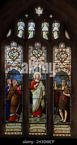 A stained glass window by Ward & Hughes, depicting Jesus as the Lamb of God, St Andrew's Church, Denton, Lincolnshire Stock Photo