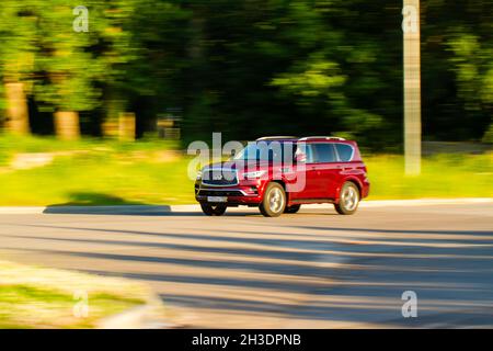 MOSCOW, RUSSIA - JUNE 20, 2021 Infiniti QX80 model year 2021 also called Infiniti QX56 in motiom. A full-size luxury SUV. Stock Photo