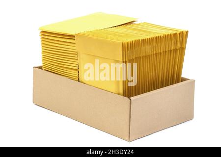 Two stacks of cushioned mailers in a kraft cardboard box isolated on white Stock Photo