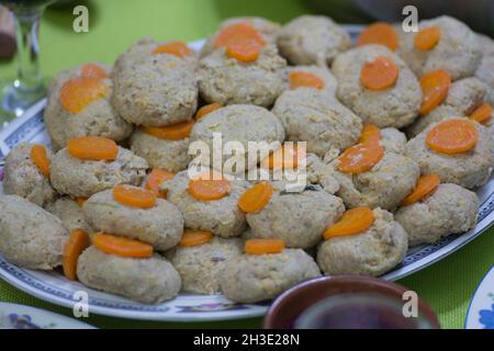 Gefilte fish, 'stuffed fish', a dish made from a poached mixture of ground deboned fish, traditionally served as an appetizer on Shabbat and Jewish ho Stock Photo