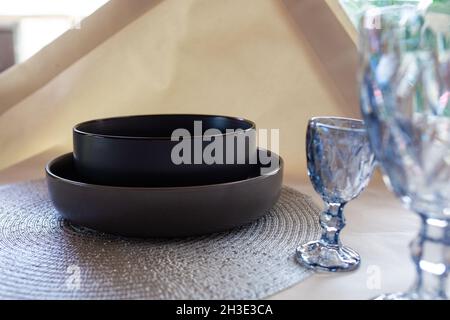 black deep soup plate on the table. Stock Photo