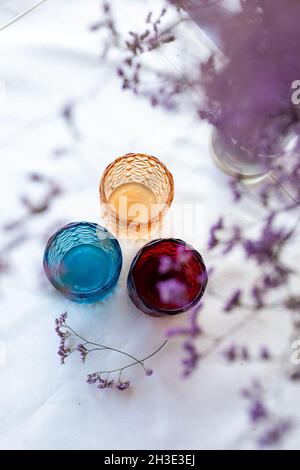 Several colored glasses on the table top view. Stock Photo