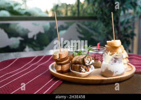 assorted snacks and sandwiches on a tray Stock Photo