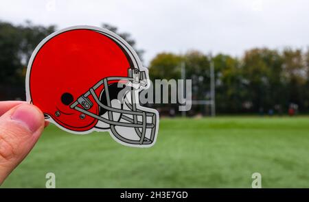 Cleveland Browns professional american football club, silhouette of NFL  trophy, logo of the club in background Stock Photo - Alamy