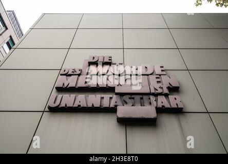 28 October 2021, Hessen, Frankfurt/Main: 'Human dignity is inviolable' is written on the façade of the Regional Court in Frankfurt am Main. The public prosecutor's office has now filed charges in connection with the 'NSU 2.0' threatening letters. Photo: Boris Roessler/dpa Stock Photo