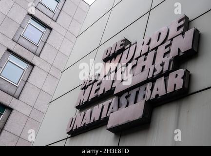 28 October 2021, Hessen, Frankfurt/Main: 'Human dignity is inviolable' is written on the façade of the Regional Court in Frankfurt am Main. The public prosecutor's office has now filed charges in connection with the 'NSU 2.0' threatening letters. Photo: Boris Roessler/dpa Stock Photo