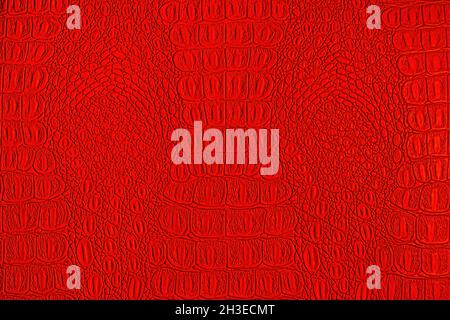 Red crocodile leather texture. Abstract background for design. Stock Photo